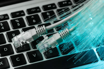 laptop keyboards with multiple connections showing advancement in technology and generative AI systems.
